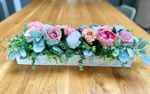 Wooden flower centrepiece in pink